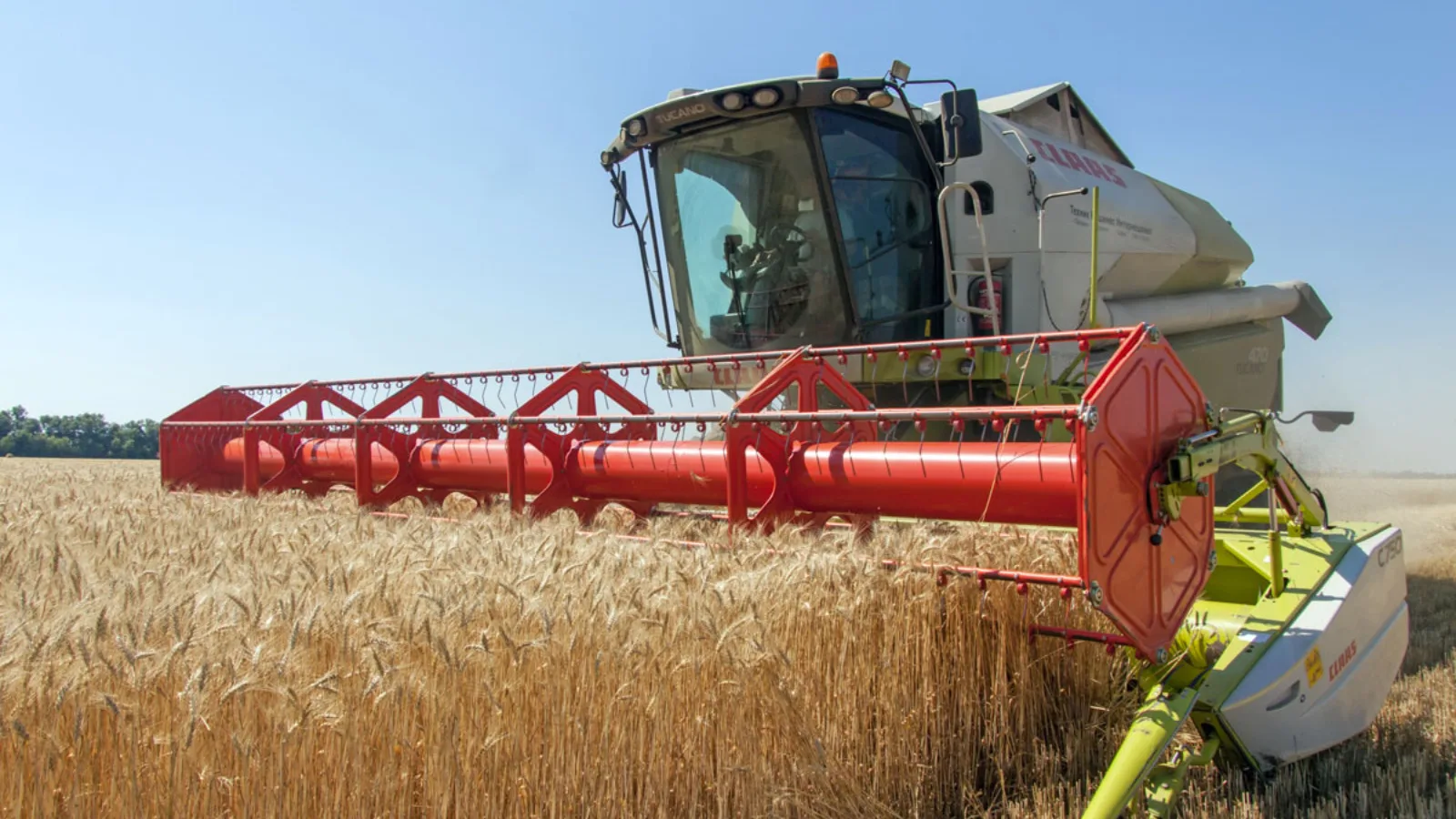Agricultural harvest machinery in a wheat field